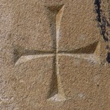 Cross on the door jamb, possibly to remind worshippers to cross themselves on entry